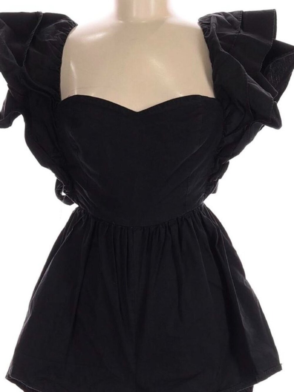 Black playsuit with ruffled sleeves and tie back detail